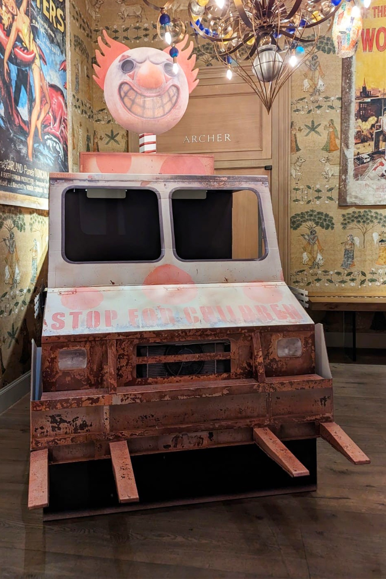 Twisted Metal ice cream van with signage backdrop